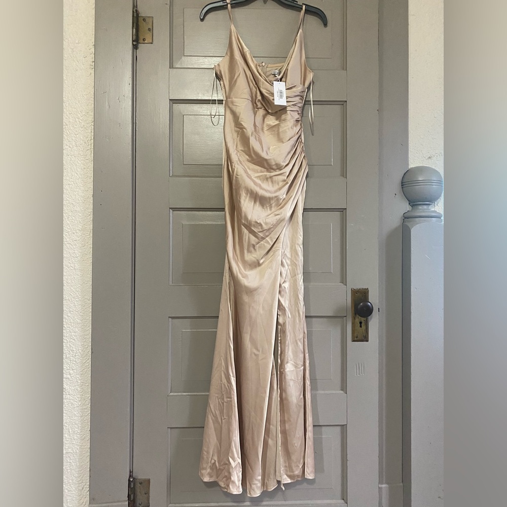 Purchased to wear as a bridesmaids dress and ended up not using.